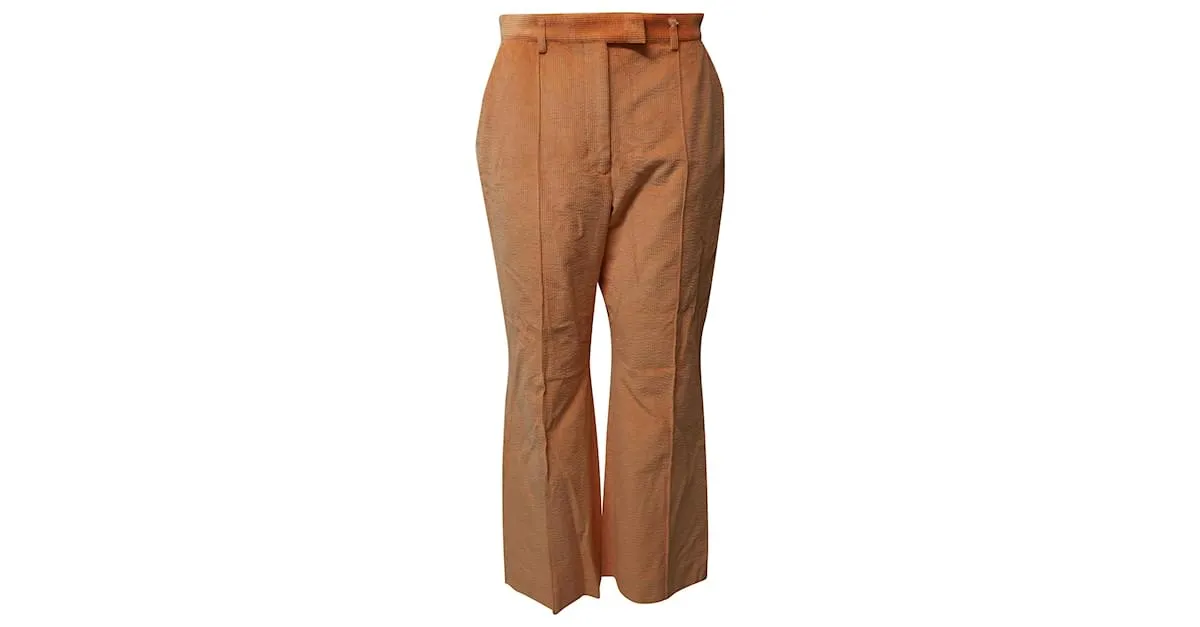 Pantalones de pana naranja con dobladillo acampanado de Acne Studios 