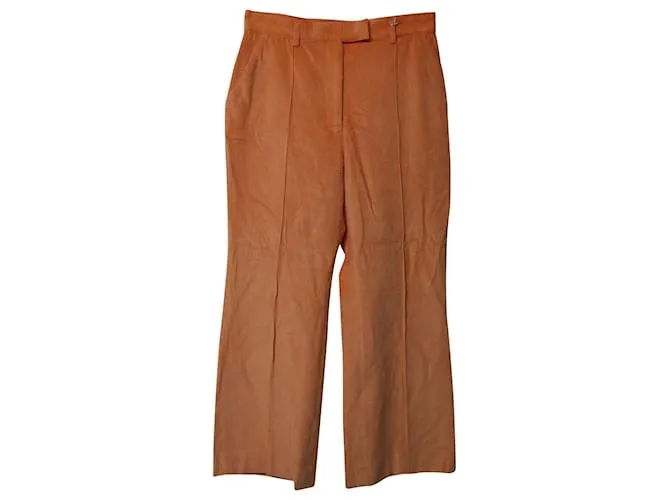 Pantalones de pana naranja con dobladillo acampanado de Acne Studios 