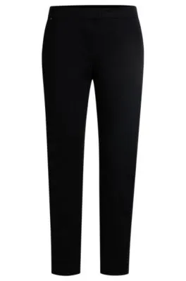 Pantalones slim fit de punto técnico elástico