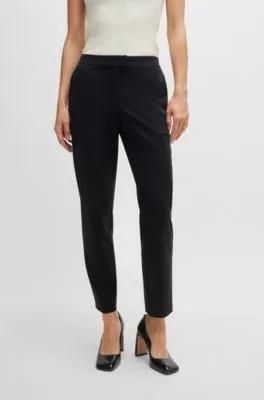 Pantalones slim fit de punto técnico elástico