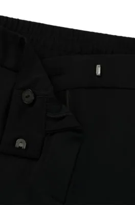 Pantalones slim fit de punto técnico elástico